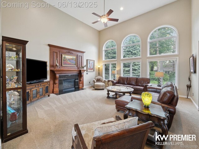 18961 Pine Ln, Macomb, MI 48042 - living room with carpet flooring, a high ceiling, a fireplace with flush hearth, a ceiling fan, and recessed lighting