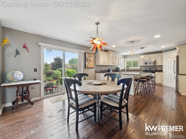 18961 Pine Ln, Macomb, MI 48042 - dining room featuring dark wood-type flooring and recessed lighting
