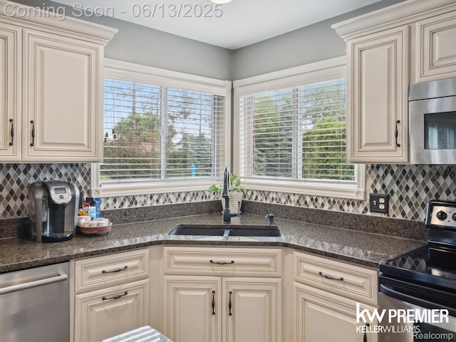 18961 Pine Ln, Macomb, MI 48042 - kitchen featuring stainless steel appliances, backsplash, and dark stone countertops