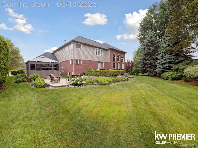 18961 Pine Ln, Macomb, MI 48042 - rear view of property featuring brick siding, a patio area, a lawn, and a sunroom