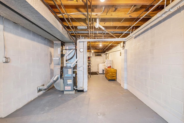 4292 Ashlawn Dr, Flint, MI 48507 - unfinished basement with washing machine and dryer and heating unit