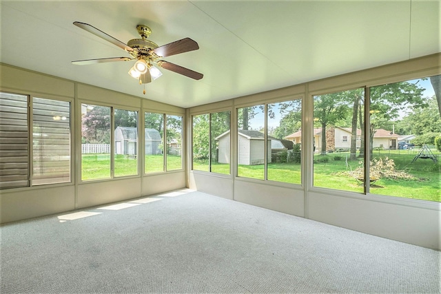 4292 Ashlawn Dr, Flint, MI 48507 - unfurnished sunroom featuring a ceiling fan and plenty of natural light