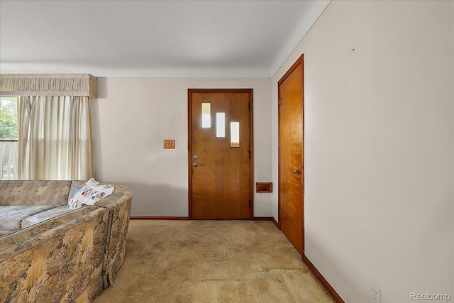 2652 Buckingham Ave, Berkley, MI 48072 - foyer with plenty of natural light, baseboards, and light colored carpet