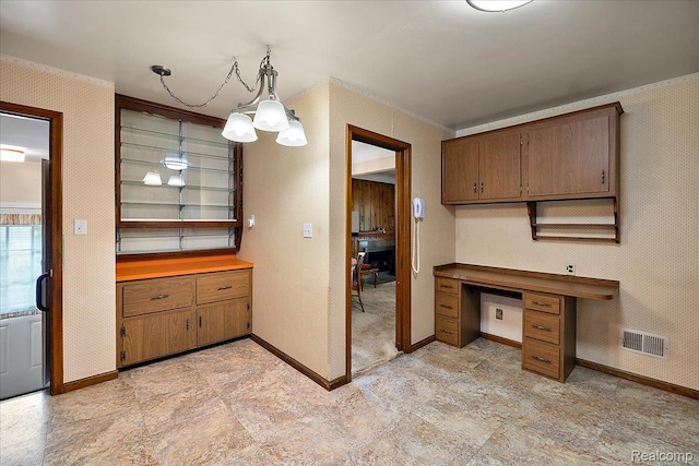 2652 Buckingham Ave, Berkley, MI 48072 - kitchen featuring baseboards, crown molding, a chandelier, brown cabinetry, and hanging light fixtures