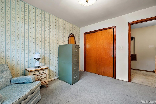 2652 Buckingham Ave, Berkley, MI 48072 - living area with carpet flooring, wallpapered walls, and baseboards