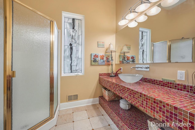 12571 Westwood Ln, Wayland, MI 49348 - bathroom with a stall shower, vanity, and tile patterned floors