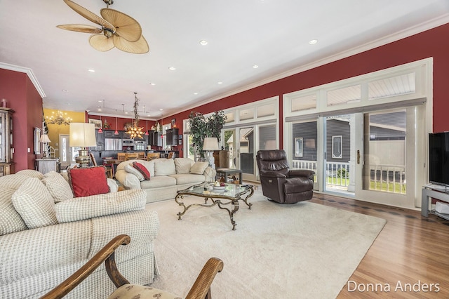 12571 Westwood Ln, Wayland, MI 49348 - living area with a chandelier, wood finished floors, recessed lighting, ornamental molding, and a ceiling fan