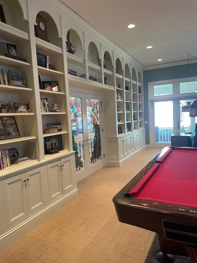 12571 Westwood Ln, Wayland, MI 49348 - game room with french doors, light colored carpet, billiards, built in shelves, and recessed lighting