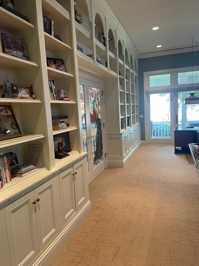 12571 Westwood Ln, Wayland, MI 49348 - mudroom featuring french doors, light colored carpet, crown molding, and built in shelves