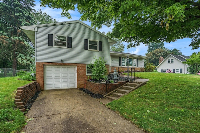 518 Hill Rd, Marshall, MI 49068 - tri-level home with a garage, concrete driveway, and brick siding