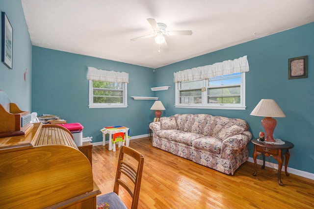 518 Hill Rd, Marshall, MI 49068 - living area with a ceiling fan, wood finished floors, and baseboards