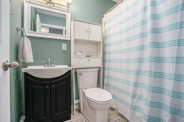 518 Hill Rd, Marshall, MI 49068 - bathroom featuring toilet, vanity, tile patterned floors, and curtained shower