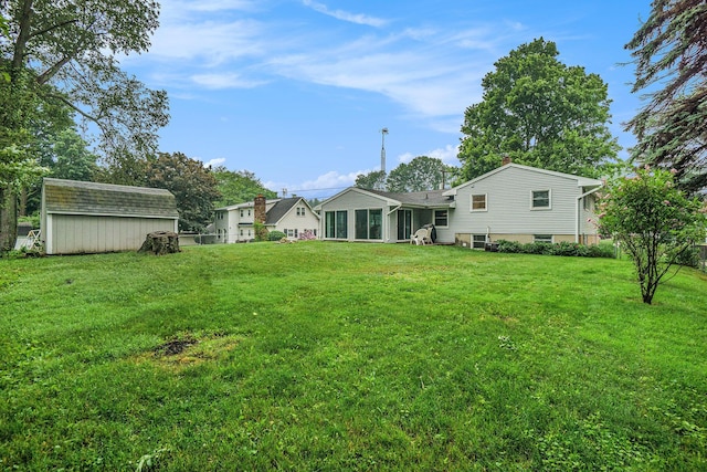518 Hill Rd, Marshall, MI 49068 - view of green lawn with a sunroom