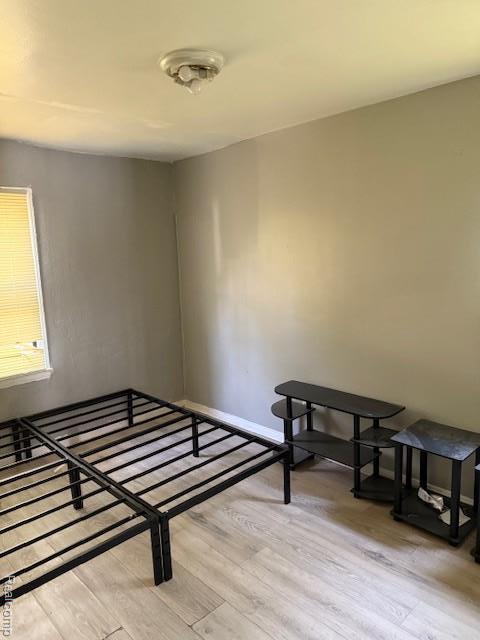 19495 Lindsay St, Detroit, MI 48235 - unfurnished bedroom with light wood finished floors and baseboards