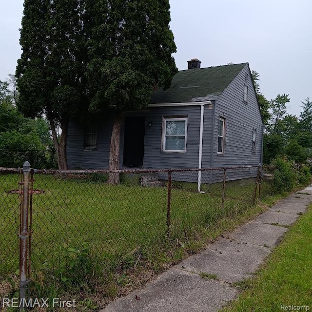 13500 Heyden St, Detroit, MI 48223 - view of front facade with a chimney