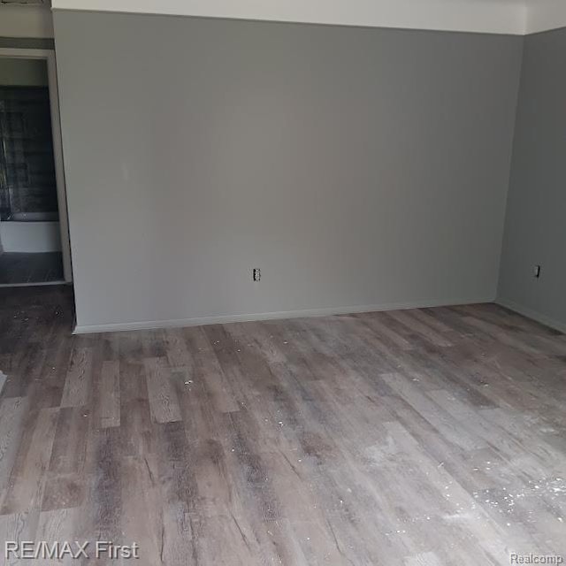 13500 Heyden St, Detroit, MI 48223 - empty room featuring wood finished floors and baseboards