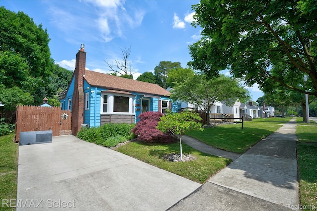 3418 Gratiot Ave, Flint, MI 48503 - bungalow-style house with a chimney and roof with shingles