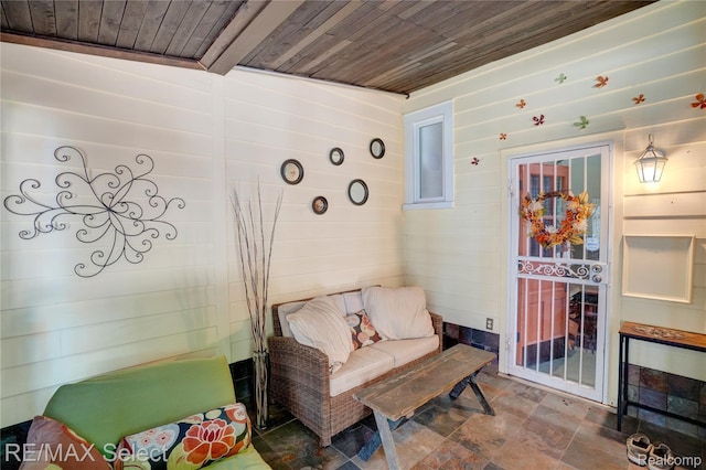 3418 Gratiot Ave, Flint, MI 48503 - living area featuring wooden ceiling, wooden walls, and stone finish floors