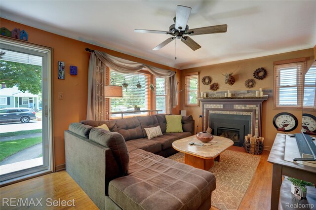 3418 Gratiot Ave, Flint, MI 48503 - living area with plenty of natural light, light wood-style floors, and a glass covered fireplace