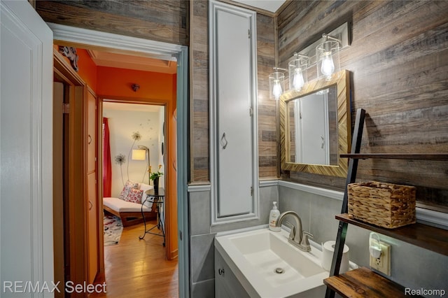 3418 Gratiot Ave, Flint, MI 48503 - bathroom with vanity, wood finished floors, and wood walls