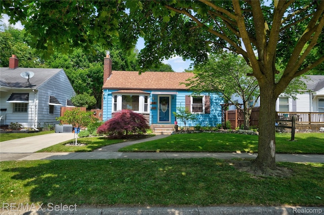 3418 Gratiot Ave, Flint, MI 48503 - view of front facade featuring a chimney and concrete driveway