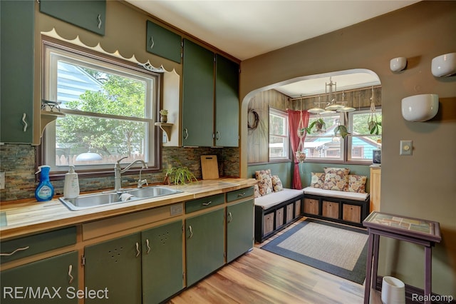 3418 Gratiot Ave, Flint, MI 48503 - kitchen featuring green cabinets, butcher block countertops, tasteful backsplash, and plenty of natural light