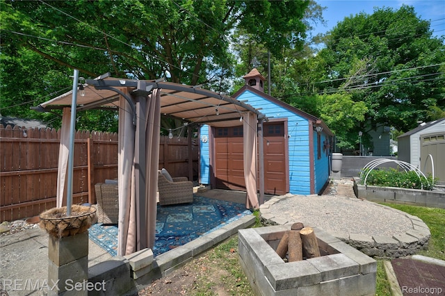 3418 Gratiot Ave, Flint, MI 48503 - view of yard with a shed and a fire pit