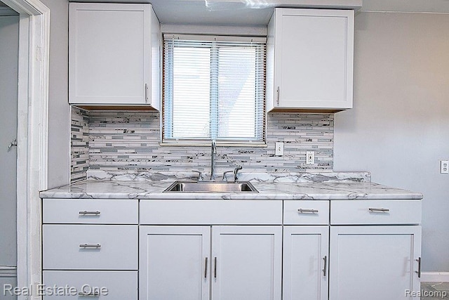 8035 Pinehurst St, Detroit, MI 48204 - kitchen featuring white cabinets and tasteful backsplash