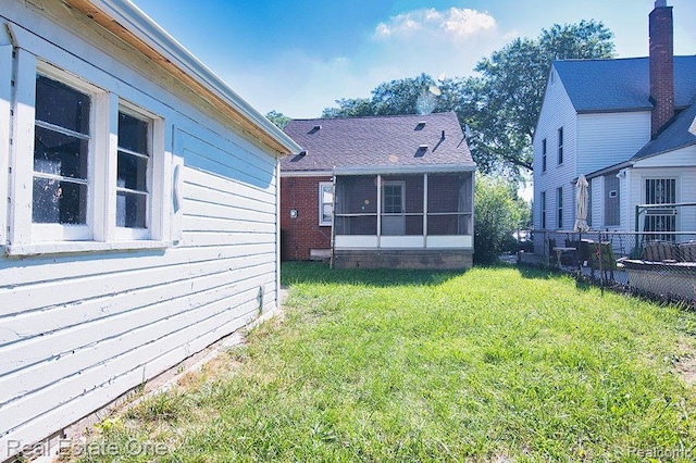 8035 Pinehurst St, Detroit, MI 48204 - view of yard featuring a sunroom
