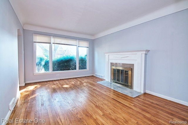 8035 Pinehurst St, Detroit, MI 48204 - unfurnished living room featuring wood finished floors and a fireplace
