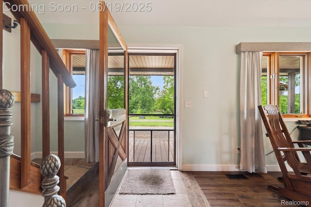 9808 Crofoot Rd, Fowlerville, MI 48836 - foyer entrance with healthy amount of natural light and wood finished floors