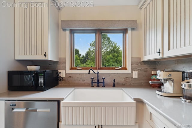 9808 Crofoot Rd, Fowlerville, MI 48836 - kitchen with dishwasher, black microwave, decorative backsplash, and light countertops