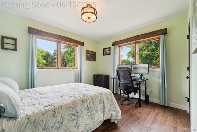 9808 Crofoot Rd, Fowlerville, MI 48836 - bedroom with multiple windows and wood-type flooring