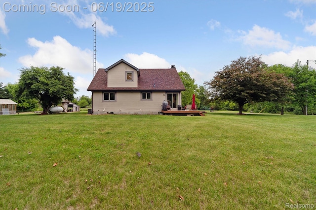 9808 Crofoot Rd, Fowlerville, MI 48836 - rear view of house with a chimney, a yard, and a deck