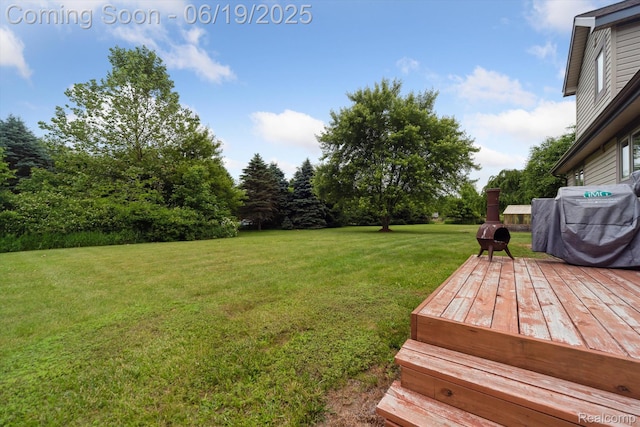 9808 Crofoot Rd, Fowlerville, MI 48836 - view of green lawn with a wooden deck