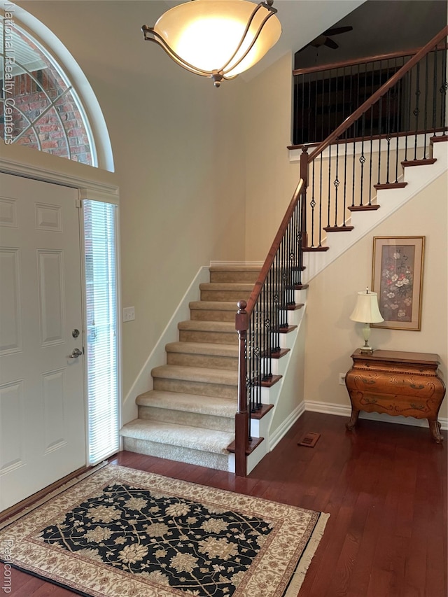 2750 Castlemartin Ct, Oakland, MI 48306 - foyer entrance featuring stairway, dark wood-style flooring, and baseboards