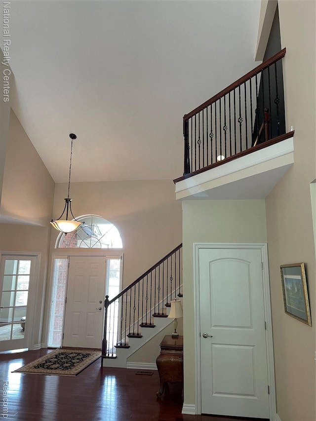 2750 Castlemartin Ct, Oakland, MI 48306 - entrance foyer with a towering ceiling, wood finished floors, stairs, and baseboards