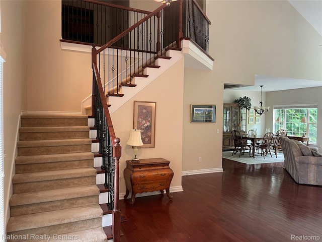2750 Castlemartin Ct, Oakland, MI 48306 - stairway with wood finished floors, a chandelier, baseboards, and a towering ceiling