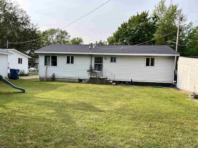 318 E N St, Standish, MI 48658 - rear view of property with a yard and roof with shingles