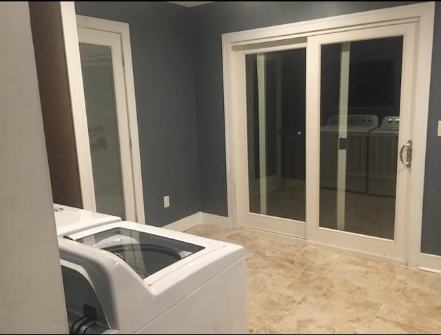 1116 Covell Ave NW, Grand Rapids, MI 49504 - washroom featuring washing machine and clothes dryer and baseboards