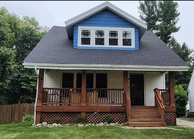1116 Covell Ave NW, Grand Rapids, MI 49504 - view of front facade with a porch and roof with shingles