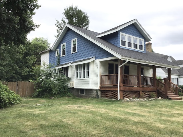 1116 Covell Ave NW, Grand Rapids, MI 49504 - rear view of property featuring a porch and roof with shingles