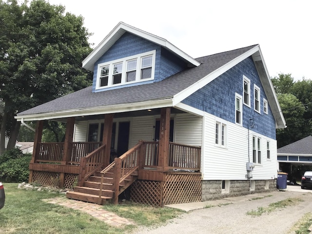 1116 Covell Ave NW, Grand Rapids, MI 49504 - view of front facade featuring roof with shingles and a porch