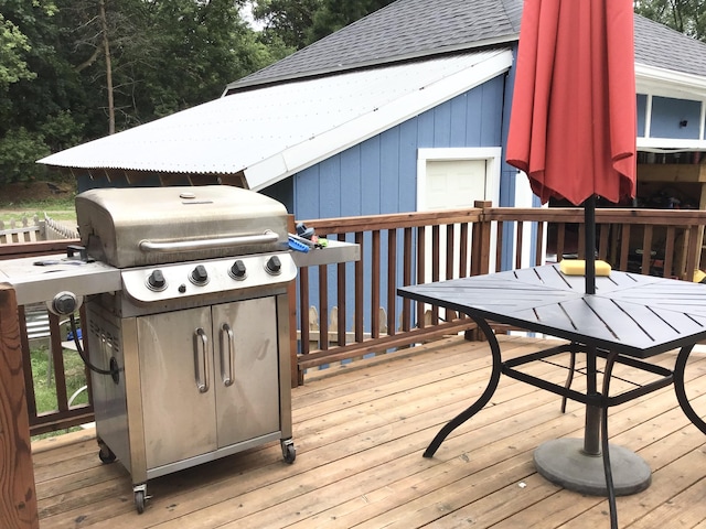 1116 Covell Ave NW, Grand Rapids, MI 49504 - wooden deck with outdoor dining space and grilling area