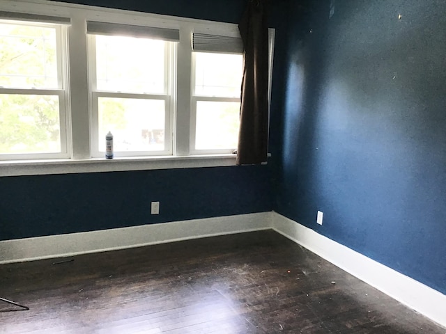 1116 Covell Ave NW, Grand Rapids, MI 49504 - spare room with hardwood / wood-style floors and baseboards