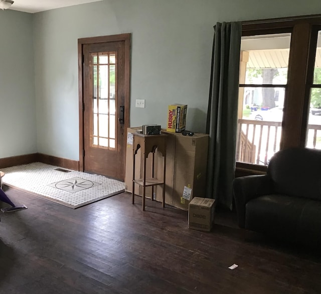 1116 Covell Ave NW, Grand Rapids, MI 49504 - doorway featuring dark wood finished floors and baseboards