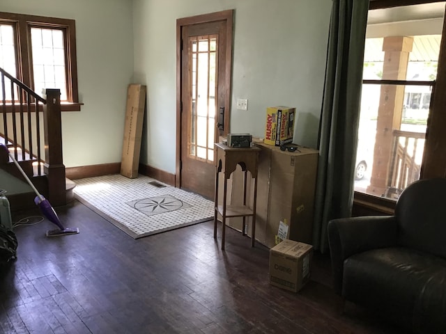 1116 Covell Ave NW, Grand Rapids, MI 49504 - entryway with dark wood-style floors and stairs