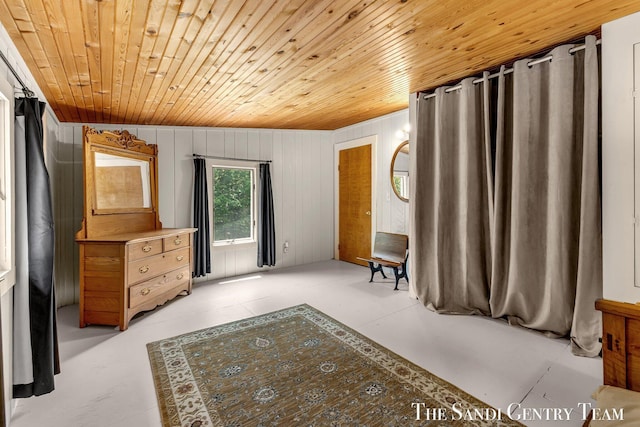 7120 Quarterline Rd, Spring Lake, MI 49456 - bedroom featuring wood ceiling, wood walls, and concrete floors