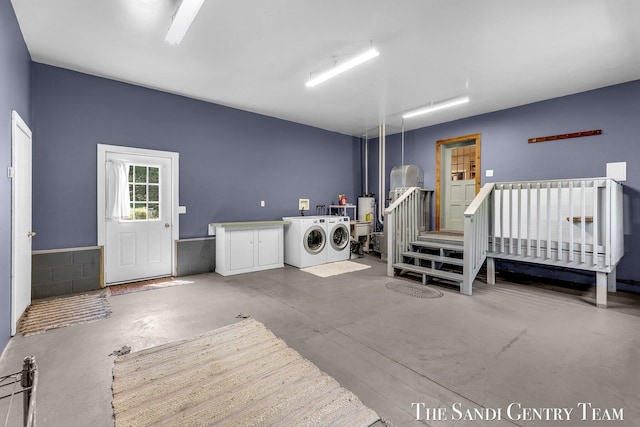 7120 Quarterline Rd, Spring Lake, MI 49456 - washroom featuring washing machine and clothes dryer and cabinet space