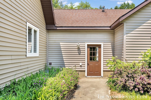 7120 Quarterline Rd, Spring Lake, MI 49456 - view of exterior entry with a shingled roof